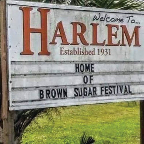 Just past the railroad tracks as you arrive in Clewiston, a sign announces the Harlem Community entrance.